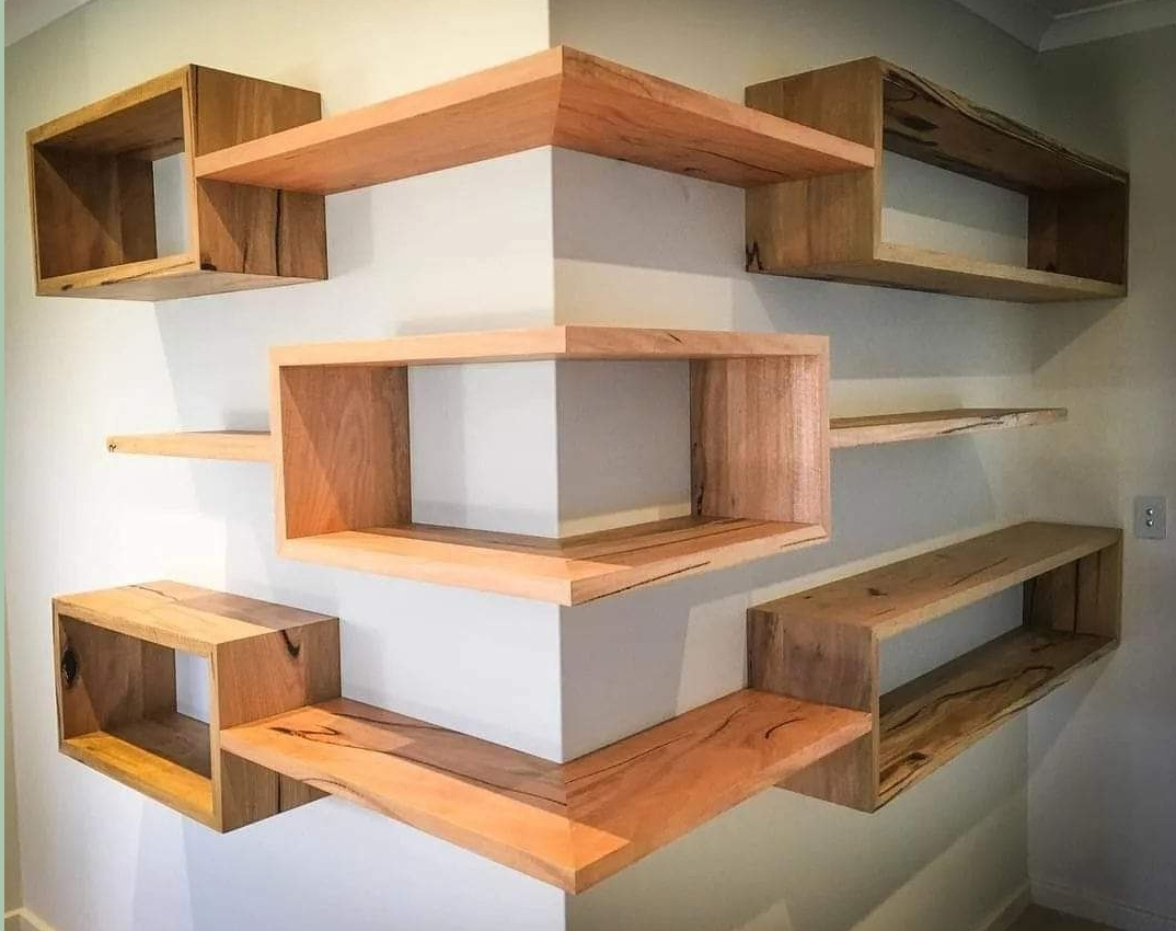 Bespoke floating corner shelving in solid timber